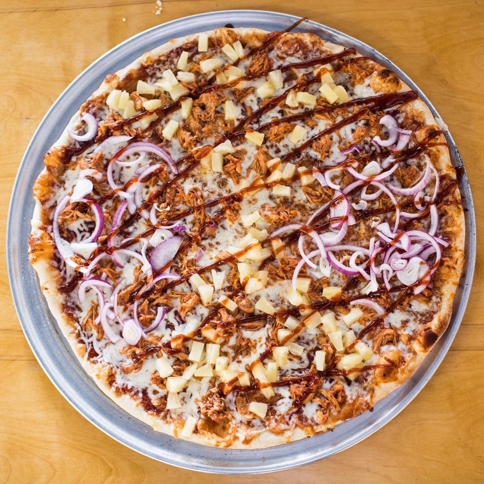 Christian's Pizza with BBQ chicken, pineapple, red onion, and a drizzle of BBQ sauce.