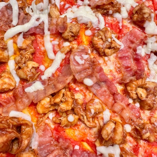 BBQ Chicken & Bacon Pizza With Red Sauce.