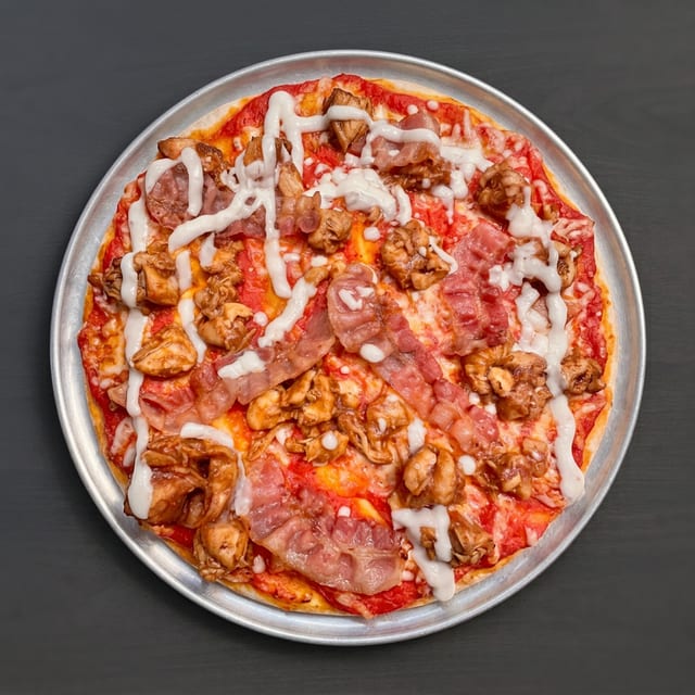 BBQ Chicken & Bacon Pizza With Red Sauce.